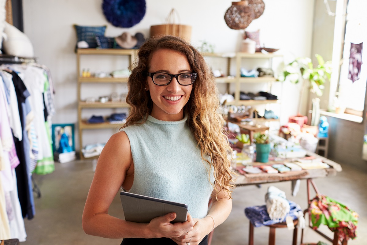 Business owner posing inside her shop