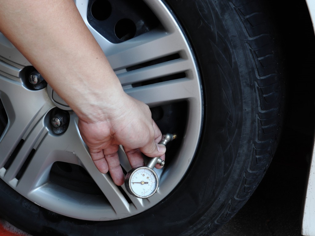 Car owner checking the wheel