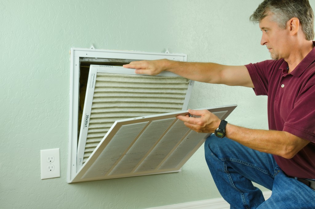 Man checking air filter
