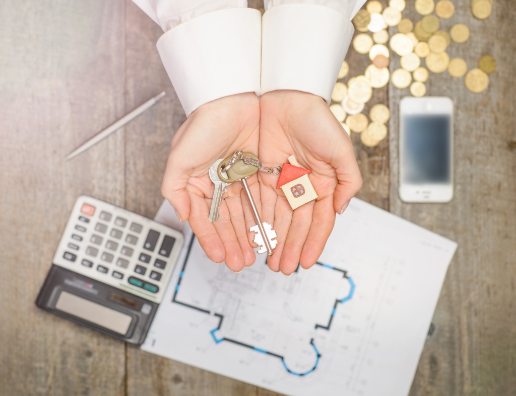 real estate agent giving house key