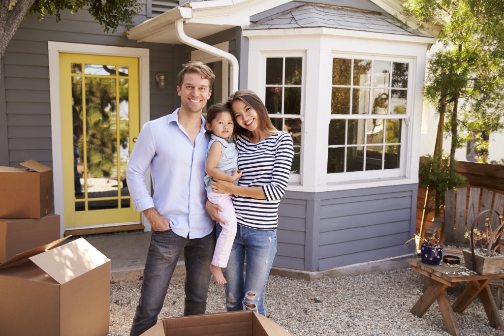 Family outside their new house
