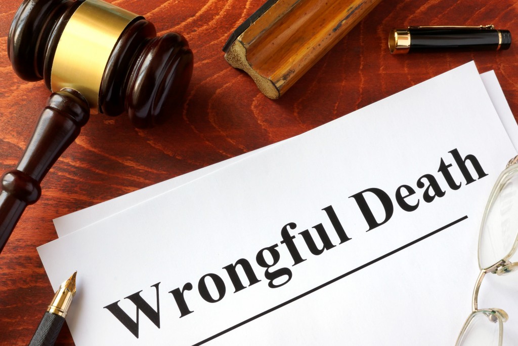 Document with title Wrongful Death o a wooden surface