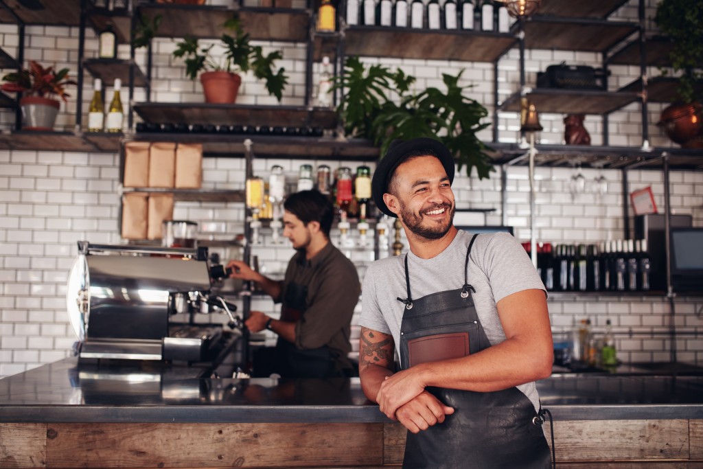 man posed by the restaurant counter
