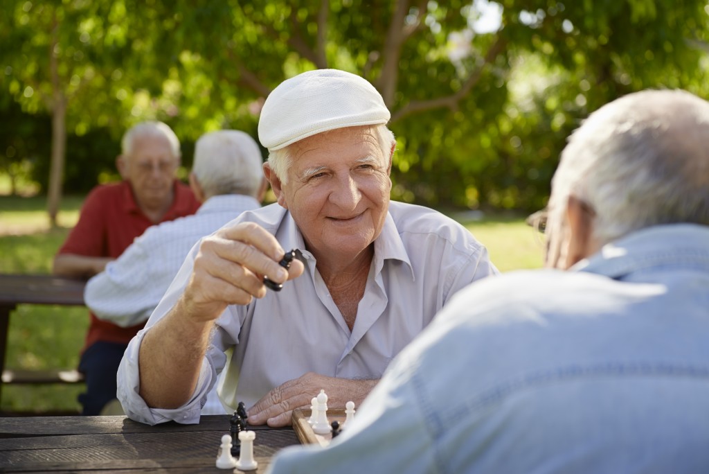 seniors playing chess outdoor