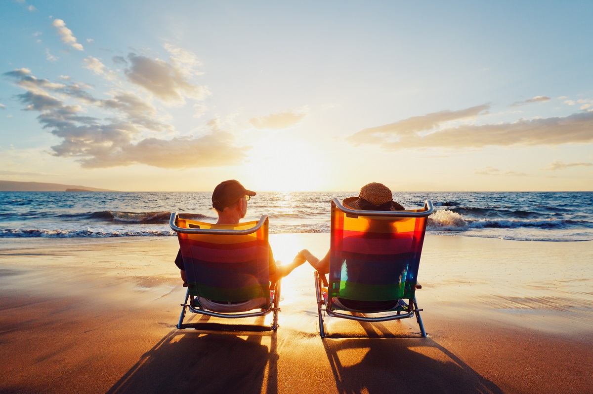 two people sitting by the beach