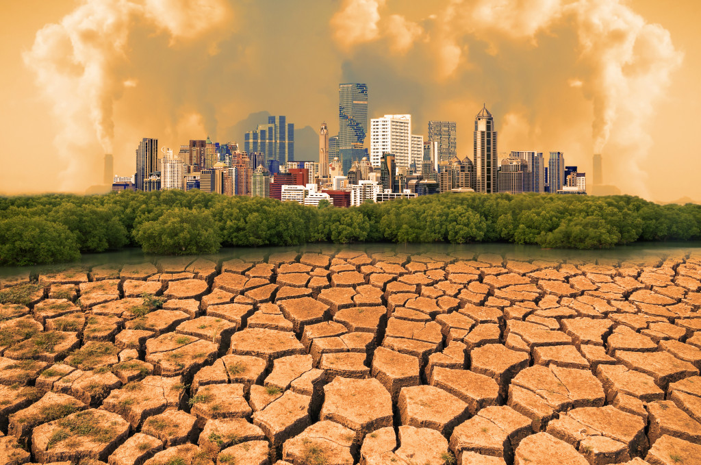 Global warming, Dry cracked earth with Pollution modern city